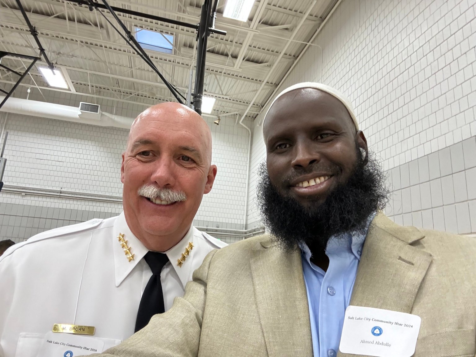 Ahmed Muse Abdulle (Idaawaqaca) with a former Salt Lake City police chief.